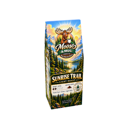 A package of Moose & Mug Sunrise Trail Light Roast coffee, featuring a colorful landscape illustration with a moose logo and mountain scenery on a white background.