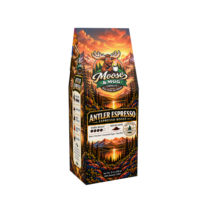 A bag of Moose & Mug Coffee Antler Espresso Roast, featuring a colorful forest and mountain landscape illustration with a moose logo on a white background.