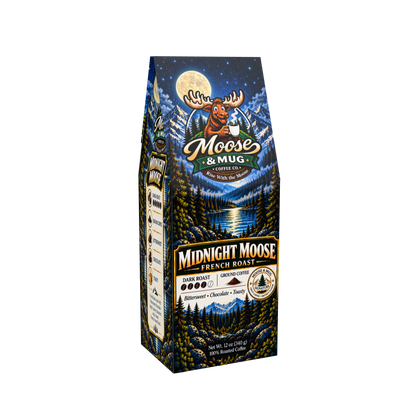 A bag of Moose & Mug Coffee Co. Midnight Moose French Roast coffee, featuring a dark blue and black illustrated design with a moose, mountain lake, and full moon on the front, and a white background.